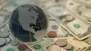 image showing a globe and a stock of paper bills
